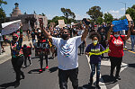 Michael Nelson of Vallejo, center, raises his hands in the air during a march to educate and eliminate racism in Vallejo, Calif., on Sunday, June 7, 2020