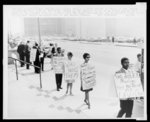 [Group of African Americans wearing picket signs protesting Black Muslims, in front of the Los Angeles County courthouse]