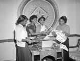 Concordia Club, Girls at YWCA unpacking articles, 1950