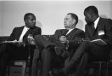 Congressman Carl Elliott seated with two other men during a meeting of educators at Alabama State College in Montgomery, Alabama.