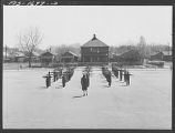 Negro schoolchildren of the Military Officers' Training Corps marching in formation for Chaplain George W. Williams, a graduate of the U. S. Army chaplain school, Fort Benjamin Harrison. The MOTC was organized at the school by teachers for those youngster