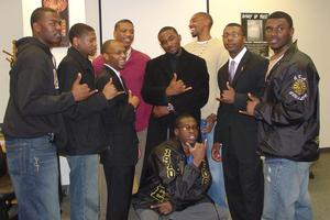 Group posing with hand signs during 2006 BHM presentations