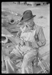 [Untitled photo, possibly related to: Mixed-breed Indian, white and Negro, near Pembroke Farms, making new chair seat. North Carolina]