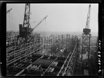 [Untitled photo, possibly related to: Baltimore, Maryland. Electric welders at work on the Liberty ship Frederick Douglass at the Bethlehem-Fairfield shipyards]