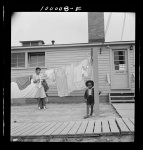 Arlington, Virginia. FSA (Farm Security Administration) trailer camp project for Negroes. Hanging out clothes which have been washed in the laundry of the community building