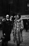 Ruth Davis and unidentified woman standing in front of Long Island station