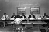 Members of the Tax Reform Study Commission listening to testimony during a meeting at the Chamber of Commerce auditorium in Huntsville, Alabama.