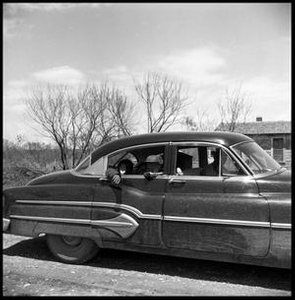 Children Waving from a Car