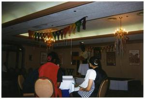 Woman Giving Speech and Audience at Service to Youth Award Program