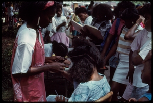 Atlanta, Georgia, 1988: National Black Arts Festival. African American hair braiding