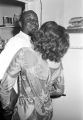 Charlie Marshall, a cook at the Laicos Club in Montgomery, Alabama, in the kitchen with a woman.