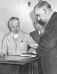 Charlie Chaplin being fingerprinted