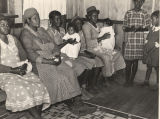 Waiting in a project clinic for examinations and treatments by a doctor and nurse in Gee's Bend, Alabama.