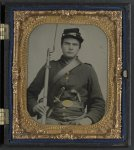 [Unidentified soldier in Union uniform with bayoneted musket, knife, and pistol]