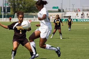 Amanda Johnson jumping for the ball