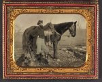 [John E. Cummins of the 50th, 99th, and 185th Ohio Infantry regiments in Union uniform next to a horse]