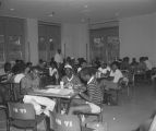 Students eating and working in a food court at Tuskegee Institute in Tuskegee, Alabama.