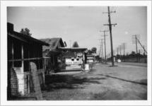 Roadside grocery with Ku Klux Klan sign