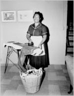 Blind (?) woman ironing