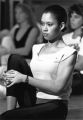 A student stretches in an exercise class, circa 1990