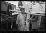 Negro stevedore, with lumber on shoulder, New Orleans, Louisiana