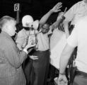 Police officers arresting a Freedom Rider after the group's arrival at the Greyhound station in Birmingham, Alabama.