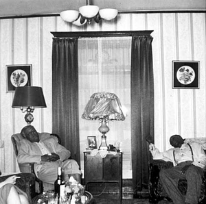 Jazz musicians sleeping in chairs, Ira Pettiford residence, 1306 Fremont Avenue North, Minneapolis.