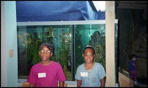 Two Young Girls and Aquarium at Children's Museum