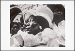 [African American woman at a civil rights demonstration in San Francisco, California, with the youth choir behind her]