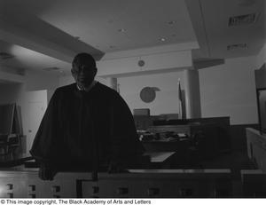 Judge L. Clifford Davis posing for portrait in courtroom