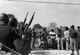 State troopers confronting demonstrators who had marched from Decatur to Cullman, Alabama, to protest the upcoming trial of Tommy Lee Hines.