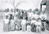 Group Portrait of Fourth Grade Students with a Religious Sister of the Sacred Heart, Christ the King Mission, Grand Coteau (Bellevue), Louisiana, 1941