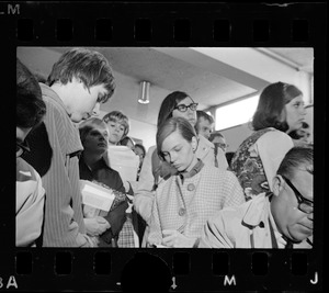 Group of students writing in notebooks during sit-in