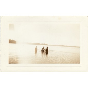 Reverend Dr. Wm. Frederick Fisher performs a baptism in the river