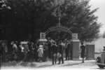 On All Saints' Day at New Roads, Louisiana Negroes assembeled in the church for preliminary ceremonies and then marched en masse to the cemetery for ceremonies there. Part of the group is shown entering the cemetery