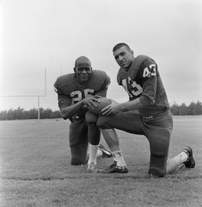 Two football players kneeling together, 5