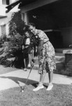 Woman practicing golf stroke