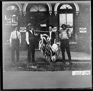 Photograph of Joe Maxwell and Henry Garret displaying fish they caught, Washington, Wilkes County, Georgia, between 1902 and 1905