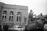 Thumbnail for Young African American man speaking through the PA system of a fire department truck after the bombing of 16th Street Baptist Church in Birmingham, Alabama.