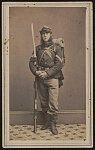 [Unidentified soldier of Co. E, 22nd New York Infantry Regiment with bayoneted rifle, bedroll, and backpack]