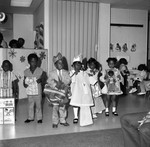 Children's fashion show participants posing together, Los Angeles, 1971