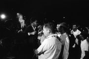 Rap Brown, Richard Boone, Stokely Carmichael, and others, standing on a street in downtown Montgomery, Alabama, during a civil rights demonstration.