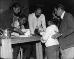 Alex Haley signing books, Los Angeles, ca. 1976