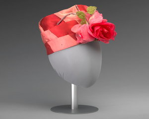 Pink and red hat with pink rose decoration from Mae's Millinery Shop