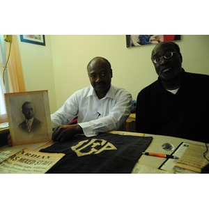 Stephen Hunter and David F. Hunter pose with a photograph of their father, Laymon Hunter