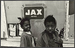 Two kids in front of Jax Beer, Mississippi