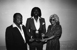 Benjamin Wright posing with an award at the Pied Piper nightclub, Los Angeles, 1984