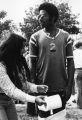 A student wraps another with toilet paper during Welcome Week activities at Marquette, fall 1973