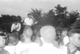 Richard Boone standing above a crowd, addressing participants in a civil rights demonstration in Montgomery, Alabama.