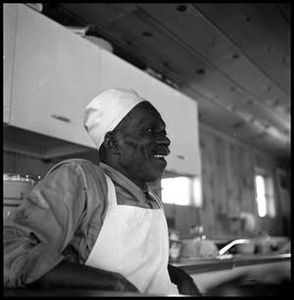 Oliver Jacobs Leaning Against a Kitchen Counter